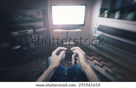 man playing video games holding invisible game controller