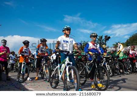 Satun, Thailand - August 18, 2014: A group of mountain bikers are waiting to release the start joint campaign tour for nature conservation on 18 August 2014.
