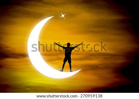 boy praying  on a moon at night.