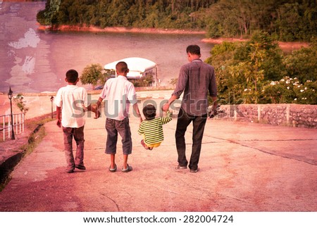 father and his three sons in old and vintage picture style.