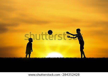 two brothers, boys play at sunset.