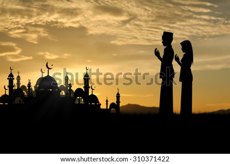 Silhouette muslim people praying at sunset,That has faith in allah God of islam supremely.
