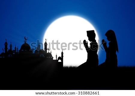 Silhouette muslim people praying at night,That has faith in allah God of islam supremely.