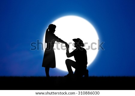 Young couple in love at  beautiful moon of night.