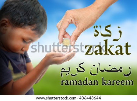 women hand give some money for child .Arabic text is spell zakat and ramadan kareem ,This means the donation is important in Ramadan.