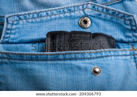 Wallet in a jeans pocket