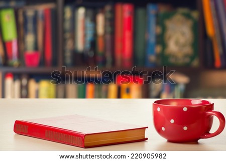 Cup and book on the table