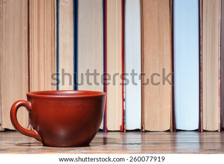 Cup on a bookshelf