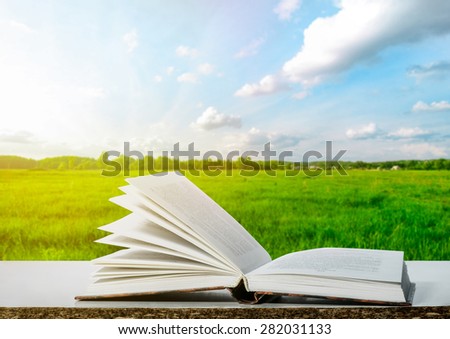 The book on a table with natural background
