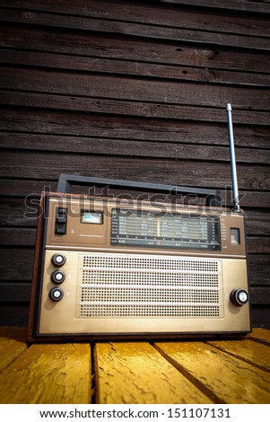 Old radio on yellow table