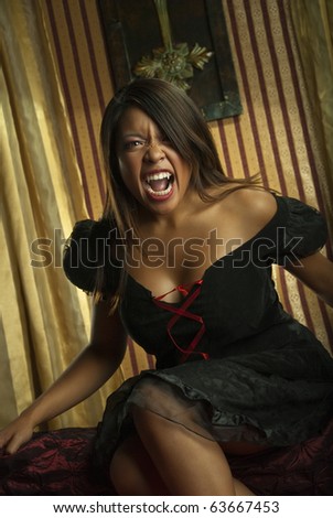Female vampire on a red and yellow background