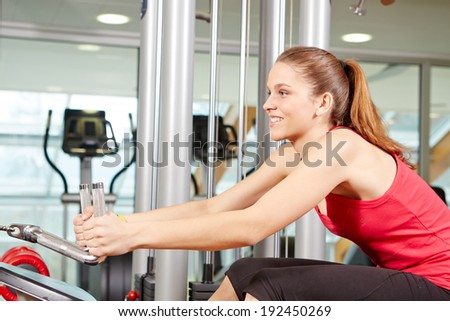 Attractive young woman in fitness sport club