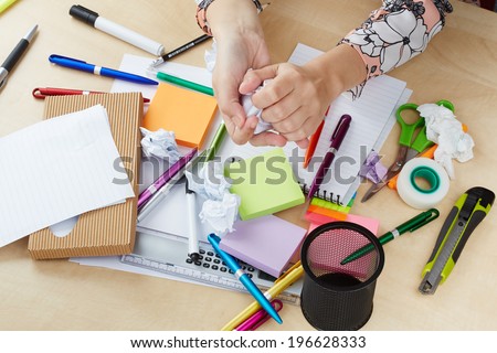 Mess on office table with hands