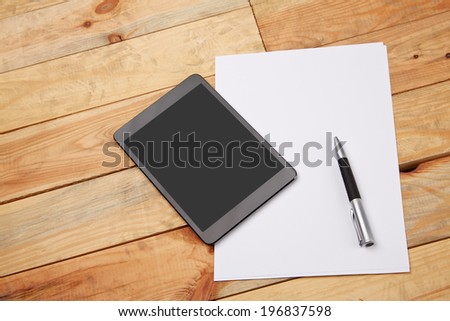 Blank note paper with ballpoint pen on the desk