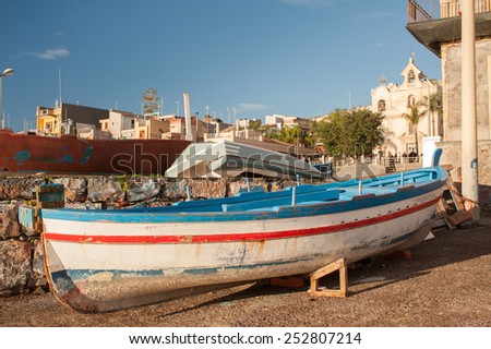 Fishing boats in a dock of the town Acitrezza, a tourist fishing village in Eastsicly