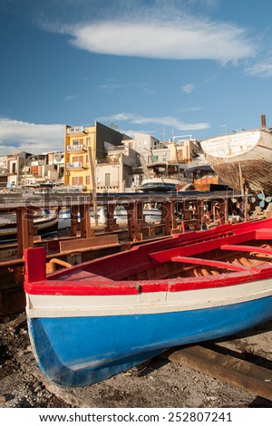 Fishing boats in a dock of the town Acitrezza, a tourist fishing village in Eastsicly