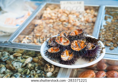 Cut sea urchins laid on a dish for sale in the public fish market of Catania, Sicily