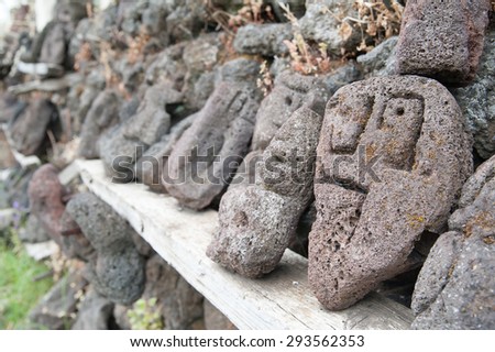 Lava stone sculpture of a stylised man\'s face