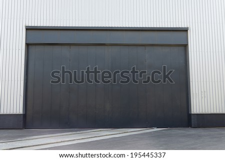 Door industrial warehouse with train tracks entering it