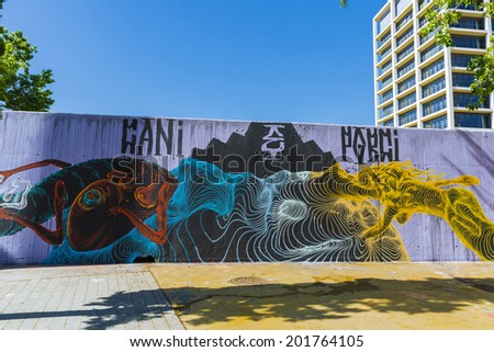 Barcelona, Spain - May 16, 2014: graffiti on textured wall in the park of the three fireplaces - Tres Ximeneies-  in Parallel avenue of Barcelona
