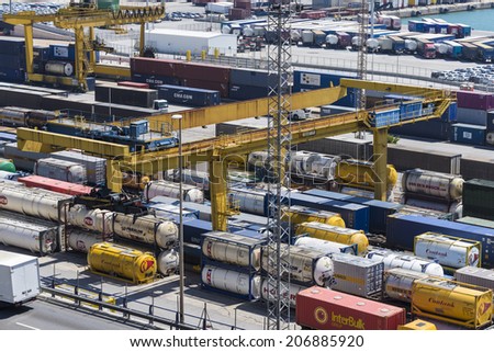 Barcelona, Spain - May 14, 2014: Overview of Container Terminal in the port of Barcelona where there are all kinds of containers, vats and new cars for export