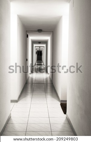 white hallway of a building apartments