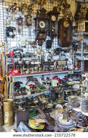 Barcelona, Spain - June 18, 2014: Objects used, furniture, artwork and ornaments on a market stall in the most famous flea market in Barcelona, also known as Els Encants or Els Encants Vells