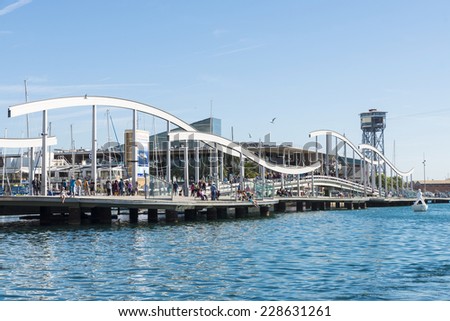 Barcelona, Spain - October 22, 2014: Tourists are strolling on the Marina Port Vell and the Rambla del Mar in Barcelona