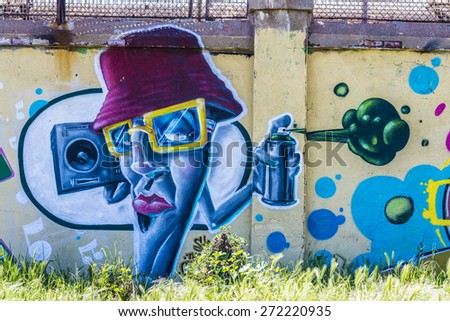 Barcelona, Spain - April 9, 2015: Wall covered with graffiti