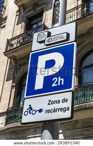 Barcelona, Spain - May 26, 2015: Signal indicating an electric charging station for electric motorbikes and cars with parking for two hours