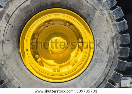 Yellow wheel of a big truck load