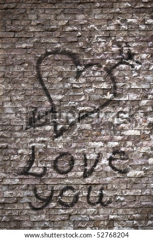 stock photo : Love you and a heart graffiti on the wall