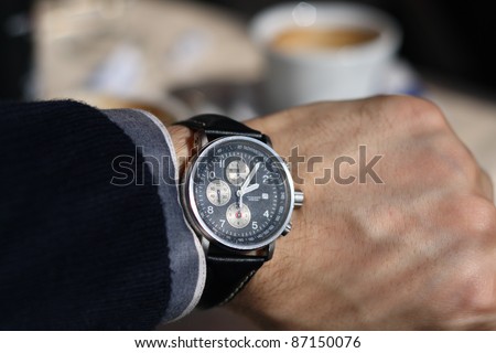 Looking at wrist watch