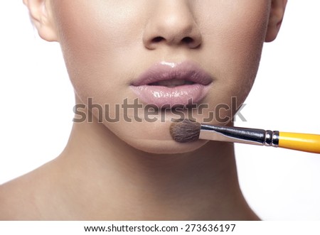 Applying make up liquid powder with brush blusher, powder line visible