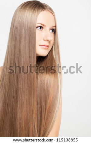 Portrait of beautiful young woman with long blond hair