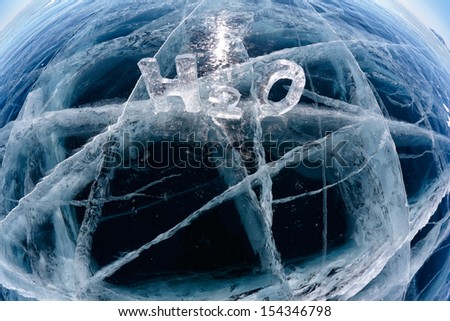 Chemical formula of water H2O made from ice on winter frozen lake Baikal