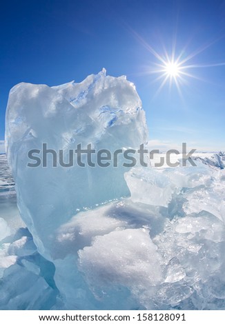 Winter Baikal lake landscape with Sun on blue sky