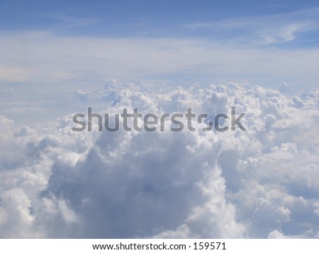 Aerial view on clouds field from the bull\'s-eye of airplane