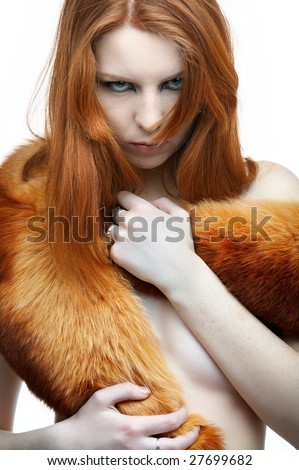 portrait of beautiful redhead pale skinned model with fox fur scarf
