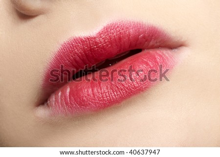 close-up of caucasian girl\'s lips zone make-up