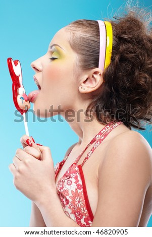 stock photo portrait of beautiful slavonic girl licking red bunnylollipop
