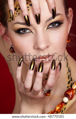 portrait of girll in cat make-up and bodyart