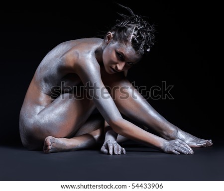 stock photo portrait of nude girl body painted with silver sitting on 