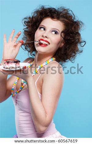 stock photo portrait of beautiful curly brunette girl with cake