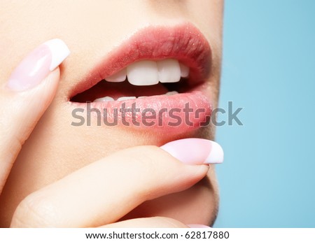 stock photo closeup portrait of beautiful girl's manicure and lipszone