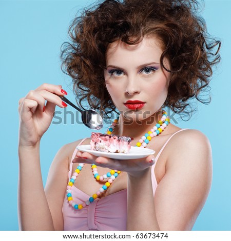 stock photo portrait of beautiful curly brunette girl with cake