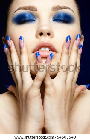 Lifestyle Stock-photo-close-up-portrait-of-beautiful-brunette-with-blue-eye-shadow-make-up-and-manicure-64603540