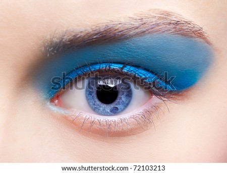 close-up portrait of beautiful girl\'s eye-zone make-up with blue eye shadows