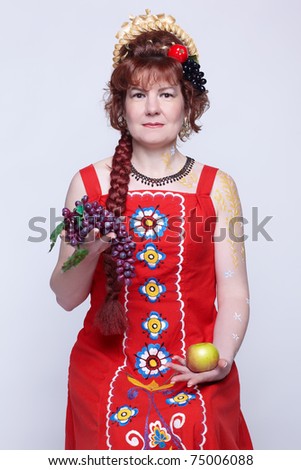 stock photo braided red haired senior woman in traditional russian dress sarafan with fruits 75006088