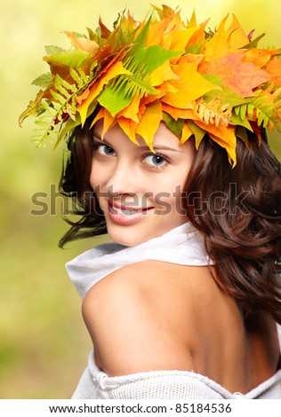 Autumn woman with crown of fall maple leaves
